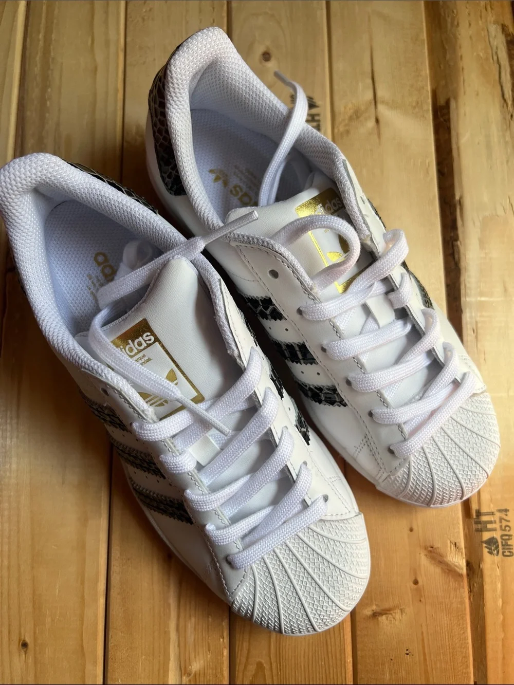 White Superstar Sneakers with Black Snakeskin Stripes